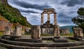 Rear view of ruins of Tholos of ancient Greek goddess Athena Pronaia in Delphi, Greece. Parts of Doric columns. UNESCO Royalty Free Stock Photo