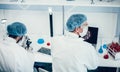 Rear view. scientist sitting at a Desk in the laboratory.