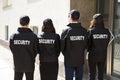 Rear View Of Security Guards Wearing Uniform Royalty Free Stock Photo