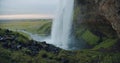 Rear view of Seljalandfoss waterfall Iceland in sunset light Royalty Free Stock Photo