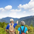 Rear view Senior couple hiking on the mountain