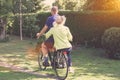 Rear view of senior couple riding a bicycle together Royalty Free Stock Photo