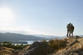 Rear View Of Senior Couple Standing At Top Of Hill On Hike Through Countryside In Lake District UK Royalty Free Stock Photo