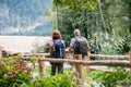 A rear view of senior pensioner couple hiking, walking. Royalty Free Stock Photo