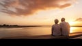 Rear view, Seniors enjoying of retirement with a beach at sunset Royalty Free Stock Photo