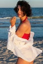 Sexy back of a beautiful woman in red bikini on sea background Royalty Free Stock Photo