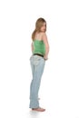 Rear view of woman in faded blue jeans