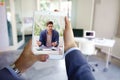 Rear view shot of businessman having online meeting in video call Royalty Free Stock Photo