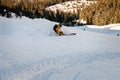 Rear view shot of freerider skier sliding down the slope at snowy mountain. Royalty Free Stock Photo