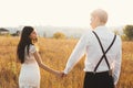 A couple enjoying a walk, holding hands, with the city on the ho Royalty Free Stock Photo