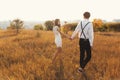 A couple enjoying a walk, holding hands, with the city on the ho Royalty Free Stock Photo