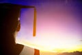 Rear view silhouette of Student  Graduation watching the sunrise Royalty Free Stock Photo