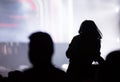 Rear view of a silhouette of a woman at concert Royalty Free Stock Photo