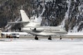 Rear view of a silver color private jet in the alps switzerland in winter Royalty Free Stock Photo