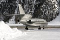 Rear view of a silver color private jet in the alps switzerland in winter Royalty Free Stock Photo