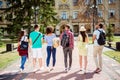 Rear view of six students, bachelor`s campus life rhythm. They a Royalty Free Stock Photo