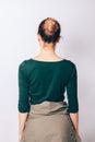 Rear view slender girl with bun hairstyle