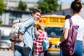 rear view of smiling teen schoolboy