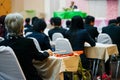 Soft focus photo of people participating conference listening to the speaker in conference room