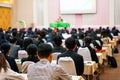 Soft focus photo of people participating conference listening to the speaker in conference room