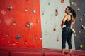 Rear view of sportswoman looking at climbing wall Royalty Free Stock Photo