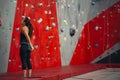 Rear view of sportswoman looking at climbing wall Royalty Free Stock Photo
