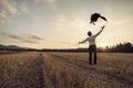 Rear view of a successful businessman throwing his coat up in th Royalty Free Stock Photo