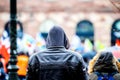 Rear view of surveillance young man wearing hoodie coat protest