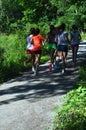 Rear View of Teenage girls running on path 3