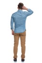 Rear view of a thinking casual man scratching his head Royalty Free Stock Photo