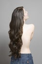 Rear View Of Topless Woman With Long Wavy Hair