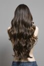 Rear View Of Topless Woman With Long Wavy Hair