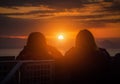 Rear view of Traveler couple woman looking sea at sunset in Shizuoka Royalty Free Stock Photo