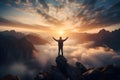 Rear view of traveler man with hands in the air stand on mountain looking on beautiful view with foggy valley and sunbeams at