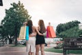 Rear view of two asian woman holding shopping bags at the outlet mall Royalty Free Stock Photo