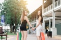 Rear view of two asian women walking to shopping in the outlet m Royalty Free Stock Photo
