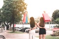 Rear view with two beautiful asian woman holding shopping bag at Royalty Free Stock Photo