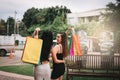 Rear view with two beautiful asian woman holding shopping bag at shopping market outdoor Royalty Free Stock Photo