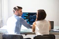 Two Stock Market Brokers Discussing Graphs On Computer Royalty Free Stock Photo