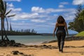 Rear view of an overweight woman walking alone on the beach