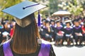 Rear view of university graduates wearing an academic gown and cap Royalty Free Stock Photo