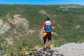 Unrecognizable hiker observing landmark over the rock