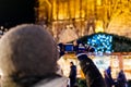 Rear view of man taking photo at Christmas Market in Strasbourg