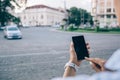 Rear view unrecognizable young woman using smart phone Royalty Free Stock Photo