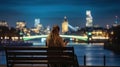 Rear view, A urban woman sitting on a bench and looking at her smartphone during night time in front of the illuminated city