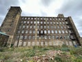 Rear view of a Victorian stone mill near, Bradford Road, Brighouse, UK