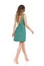 Rear View Of Walking Woman In Green Mini Dress And High Heels Royalty Free Stock Photo