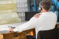 Rear view of warehouse manager using computer Royalty Free Stock Photo