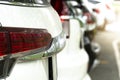 Rear view of white car in parking area. Royalty Free Stock Photo