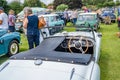 Looking down on a classic open top Triumph car on display at a public car show